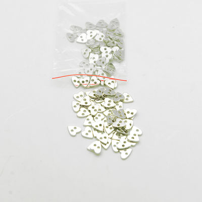 Heart-shaped sew-on polyester button (flat)